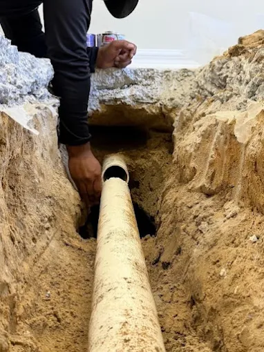 Hometown Hero's Plumbing technician repairing an under-slab drain pipe